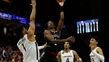 Mar 4, 2023; Charlottesville, Virginia, USA; Louisville Cardinals guard Mike James (1) shoots the ball as Virginia Cavaliers forward Jayden Gardner (1) defends in the first half at John Paul Jones Arena. Mandatory Credit: Geoff Burke-USA TODAY Sports