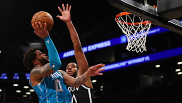 NEW YORK, NY - OCTOBER 24: Miles Bridges #0 of the Charlotte Hornets attempts a shot as LaMarcus Aldridge #21 of the Brooklyn Nets defends during the second half of a game at Barclays Center on October 24, 2021 in New York City. The Hornets defeated the Nets 111-95.NOTE TO USER: User expressly acknowledges and agrees that, by downloading and or using this photograph, User is consenting to the terms and conditions of the Getty Images License Agreement. (Photo by Rich Schultz/Getty Images)
