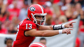 Georgia football quarterback, Stetson Bennett calls out a formation in the first half against the Samford Bulldogs. (Photo by Todd Kirkland/Getty Images)