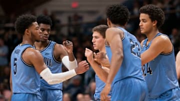 VILLANOVA, PA - DECEMBER 04: Justin Moore #5, Brandon Slater #3, Collin Gillespie #2, Jermaine Samuels #23, and Jeremiah Robinson-Earl #24 of the Villanova Wildcats huddle against the Pennsylvania Quakers in the second half at Finneran Pavilion on December 4, 2019 in Villanova, Pennsylvania. The Villanova Wildcats defeated the Pennsylvania Quakers 80-69. (Photo by Mitchell Leff/Getty Images)