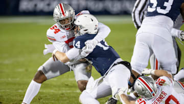 STATE COLLEGE, PA - OCTOBER 31: Sean Clifford #14 of the Penn State Nittany Lions is tackled by Pete Werner #20 and Tyler Friday #54 of the Ohio State Buckeyes during the first half at Beaver Stadium on October 31, 2020 in State College, Pennsylvania. (Photo by Scott Taetsch/Getty Images)