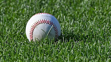 Jul 6, 2021; Kansas City, Missouri, USA; A detail view of a baseball on the field during batting practice prior to a game between the Kansas City Royals and Cincinnati Reds at Kauffman Stadium. Mandatory Credit: Peter Aiken-USA TODAY Sports