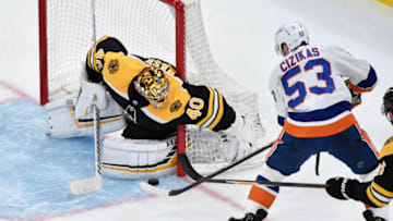 May 31, 2021; Boston, Massachusetts, USA; New York Islanders center Casey Cizikas (53) tries to shoot the puck past Boston Bruins goaltender Tuukka Rask (40) during the second period in game two of the second round of the 2021 Stanley Cup Playoffs at TD Garden. Mandatory Credit: Bob DeChiara-USA TODAY Sports