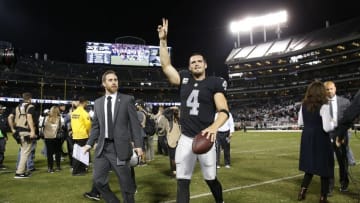 Nov 6, 2016; Oakland, CA, USA; Oakland Raiders quarterback Derek Carr (4) waves to the crowd after the Raiders defeated the Denver Broncos 30-20 at Oakland Coliseum. Mandatory Credit: Cary Edmondson-USA TODAY Sports