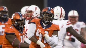 Oct 3, 2015; Champaign, IL, USA; Illinois Fighting Illini defensive end Dawuane Smoot (91) celebrates after sacking Nebraska Cornhuskers quarterback Tommy Armstrong Jr. (4) at Memorial Stadium. The Fighting Illini won 14 - 13. Mandatory Credit: Mike Granse-USA TODAY Sports