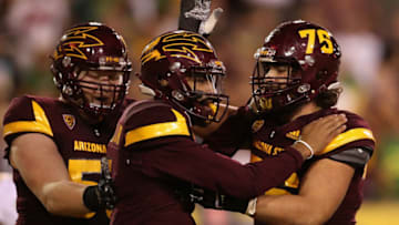 TEMPE, AZ - SEPTEMBER 23: Quarterback Manny Wilkins #5 of the Arizona State Sun Devils celebrates with offensive lineman Tyler McClure #75 after scoring on a two yard rushing touchdown against the Oregon Ducks during the second half of the college football game at Sun Devil Stadium on September 23, 2017 in Tempe, Arizona. (Photo by Christian Petersen/Getty Images)