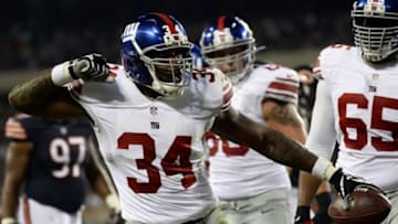 Oct 10, 2013; Chicago, IL, USA; New York Giants running back Brandon Jacobs (34) reacts after scoring a touchdown during the first half at Soldier Field. Mandatory Credit: Mike DiNovo-USA TODAY Sports