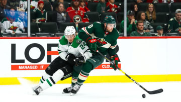 ST. PAUL, MN - SEPTEMBER 20: Dallas Stars center Roope Hintz (24), left, and Minnesota Wild defenseman Carson Soucy (60) fight for the puck during the preseason game between the Dallas Stars and the Minnesota Wild on September 20, 2018 at Xcel Energy Center in St. Paul, Minnesota. The Stars defeated the Wild 3-1. (Photo by David Berding/Icon Sportswire via Getty Images)