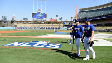 LOS ANGELES, CA - OCTOBER 18: Pitchers Kenta Maeda #18 and Julio Urias #7 of the Los Angeles Dodgers walk on the field prior to taking on the Chicago Cubs in game three of the National League Championship Series at Dodger Stadium on October 18, 2016 in Los Angeles, California. (Photo by Harry How/Getty Images)