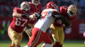 Oct 5, 2014; Santa Clara, CA, USA; Kansas City Chiefs defensive lineman Allen Bailey (97) tackles San Francisco 49ers quarterback Colin Kaepernick (7) at Levi