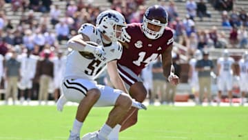Oct 7, 2023; Starkville, Mississippi, USA; Western Michigan Broncos wide receiver Anthony Sambucci (5) runs the ball while defended by Mississippi State Bulldogs linebacker Nathaniel Watson (14) during the first quarter at Davis Wade Stadium at Scott Field. Mandatory Credit: Matt Bush-USA TODAY Sports