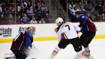Mar 9, 2016; Denver, CO, USA; Anaheim Ducks center Andrew Cogliano (7) attempts to score on Colorado Avalanche goalie Semyon Varlamov (1) as defenseman Tyson Barrie (4) defends in the third period at the Pepsi Center. The Avalanche defeated the Ducks 3-0. Mandatory Credit: Ron Chenoy-USA TODAY Sports