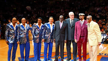 Mar 27, 2015; New York, NY, USA; Vocal group the Four Tops with former NBA player Earl Monroe (purple tie) and New York Knicks president Phil Jackson and Walt Frazier and former NBA player Dick Barnett (right) acknowledge Walt Frazier for his 70th birthday during the game between the New York Knicks and the Boston Celtics at Madison Square Garden. Mandatory Credit: Anthony Gruppuso-USA TODAY Sports