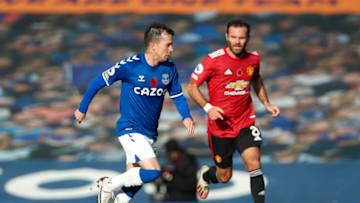 LIVERPOOL, ENGLAND - NOVEMBER 07: Bernard of Everton runs with the ball under pressure from Juan Mata of Manchester United during the Premier League match between Everton and Manchester United at Goodison Park on November 07, 2020 in Liverpool, England. Sporting stadiums around the UK remain under strict restrictions due to the Coronavirus Pandemic as Government social distancing laws prohibit fans inside venues resulting in games being played behind closed doors. (Photo by Clive Brunskill/Getty Images)