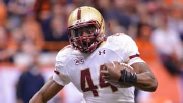Nov 30, 2013; Syracuse, NY, USA; Boston College Eagles running back Andre Williams (44) runs around the end during the first quarter of a game against the Syracuse Orange at the Carrier Dome.Syracuse won the game 34-31. Mandatory Credit: Mark Konezny-USA TODAY Sports