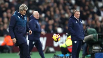 LONDON, ENGLAND - DECEMBER 04: Manuel Pellegrini, West Ham Head Coach controls the ball during the Premier League match between West Ham United and Cardiff City at London Stadium on December 04, 2018 in London, United Kingdom. (Photo by Julian Finney/Getty Images)