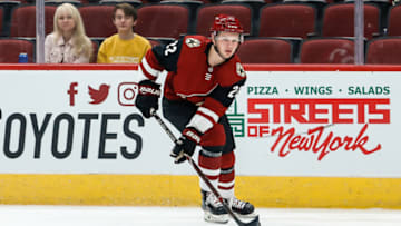 GLENDALE, AZ - SEPTEMBER 18: Arizona Coyotes center Barrett Hayton (22) controls the puck during the preseason NHL hockey game between the Los Angeles Kings and the Arizona Coyotes on Sep 18, 2018 at Gila River Arena in Glendale, Arizona. (Photo by Kevin Abele/Icon Sportswire via Getty Images)