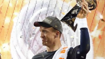 Feb 7, 2016; Santa Clara, CA, USA; Denver Broncos quarterback Peyton Manning (18) celebrates with the Vince Lombardi Trophy after beating the Carolina Panthers in Super Bowl 50 at Levi