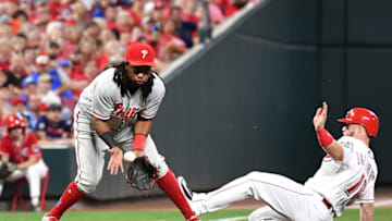 CINCINNATI, OH - JULY 27: Tucker Barnhart #16 of the Cincinnati Reds slides safely in to third base as Maikel Franco #7 of the Philadelphia Phillies takes the throw in the eighth inning at Great American Ball Park on July 27, 2018 in Cincinnati, Ohio. (Photo by Jamie Sabau/Getty Images)