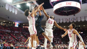 NORMAN, OKLAHOMA- DECEMBER 07: Elijah Harkless #55 and Jalen Hill #1 of the Oklahoma Sooners blocks Jayden Taylor #13 of the Butler Bulldogs shot during a college basketball game at the Lloyd Noble Center on December 7, 2021 in Norman, Oklahoma. (Photo by Mitchell Layton/Getty Images)