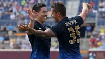 Aug 2, 2014; Minneapolis, MN, USA; Manchester City forward Stevan Jovetic (35) celebrates with Samir Nasri (8) after scoring a goal during the first half against Olympiakos at TCF Bank Stadium. Mandatory Credit: Brace Hemmelgarn-USA TODAY Sports