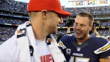 Dec 29, 2013; San Diego, CA, USA; San Diego Chargers quarterback Philip Rivers (17) talks with Kansas City Chiefs quarterback Alex Smith (11) after a Chargers win at Qualcomm Stadium. The Chargers won 27-24 in overtime. Mandatory Credit: Christopher Hanewinckel-USA TODAY Sports
