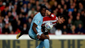 BRENTFORD, ENGLAND - OCTOBER 21: Lasse Vibe of Brentford and Lamine Kone of Sunderland challenge for the ball during the Sky Bet Championship match between Brentford and Sunderland at Griffin Park on October 21, 2017 in Brentford, England. (Photo by Jordan Mansfield/Getty Images)