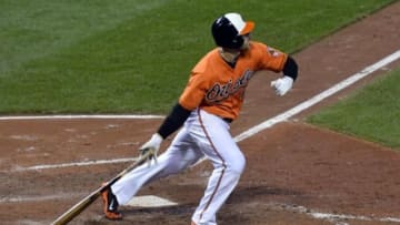 Sep 30, 2015; Baltimore, MD, USA; Baltimore Orioles designated hitter Chris Davis (19) hits a solo home run during the seventh inning against the Toronto Blue Jays at Oriole Park at Camden Yards. Mandatory Credit: Tommy Gilligan-USA TODAY Sports