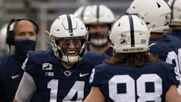 STATE COLLEGE, PA - DECEMBER 12: Sean Clifford #14 of the Penn State Nittany Lions celebrates with teammates after throwing a pass for a touchdown against the Michigan State Spartans during the second half at Beaver Stadium on December 12, 2020 in State College, Pennsylvania. (Photo by Scott Taetsch/Getty Images)