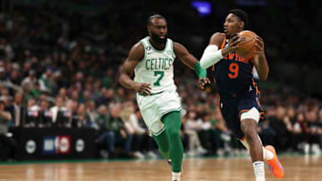 BOSTON, MASSACHUSETTS - JANUARY 26: RJ Barrett #9 of the New York Knicks drives towards the basket past Jaylen Brown #7 of the Boston Celtics during the first half at TD Garden on January 26, 2023 in Boston, Massachusetts. NOTE TO USER: User expressly acknowledges and agrees that, by downloading and or using this photograph, User is consenting to the terms and conditions of the Getty Images License Agreement. (Photo by Maddie Meyer/Getty Images)