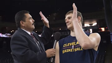 June 1, 2016; Oakland, CA, USA; Television personalty Guillermo Rodriguez (left) interviews Cleveland Cavaliers center Timofey Mozgov (20, right) during NBA Finals media day at Oracle Arena. Mandatory Credit: Kyle Terada-USA TODAY Sports