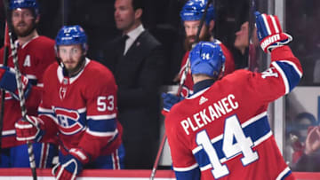 MONTREAL, QC - OCTOBER 15: Tomas Plekanec #14 of the Montreal Canadiens raises his arm in appreciation for playing in his 1000th career NHL game against the Detroit Red Wings at the Bell Centre on October 15, 2018 in Montreal, Quebec, Canada. The Montreal Canadiens defeated the Detroit Red Wings 7-3. (Photo by Minas Panagiotakis/Getty Images)