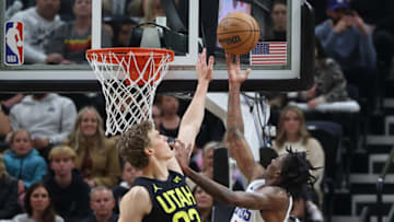 Oct 27, 2023; Salt Lake City, Utah, USA; Los Angeles Clippers guard Bones Hyland (5) lays the ball up against Utah Jazz forward Lauri Markkanen (23) in the second quarter at Delta Center. Mandatory Credit: Rob Gray-USA TODAY Sports