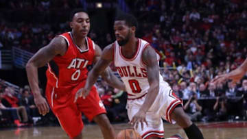 Jan 17, 2015; Chicago, IL, USA; Chicago Bulls guard Aaron Brooks (0) drives past Atlanta Hawks guard Jeff Teague (0) during the second half at the United Center. Atlanta won 107-99. Mandatory Credit: Dennis Wierzbicki-USA TODAY Sports