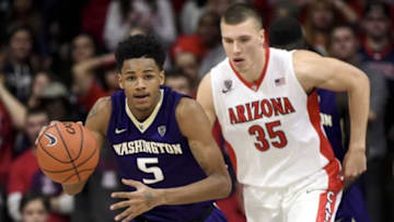 Jan 14, 2016; Tucson, AZ, USA; Washington Huskies guard Dejounte Murray (5) dribbles the ball in front of Arizona Wildcats center Kaleb Tarczewski (35) during the first half at McKale Center. Arizona won 99-67. Mandatory Credit: Casey Sapio-USA TODAY Sports