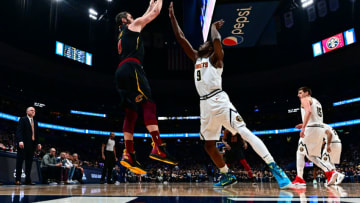 Kevin Love (0) shoots over Denver Nuggets forward Jerami Grant (9) . Mandatory Credit: Ron Chenoy-USA TODAY Sports
