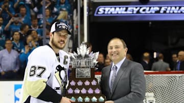 Jun 12, 2016; San Jose, CA, USA; NHL commissioner Gary Bettman presents Pittsburgh Penguins center Sidney Crosby (87) with the Stanley Cup after defeating the San Jose Sharks in game six of the 2016 Stanley Cup Final at SAP Center at San Jose. Mandatory Credit: Bruce Bennett/Pool Photo via USA TODAY Sports