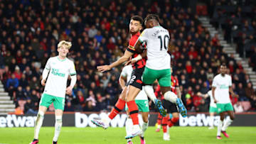 BOURNEMOUTH, ENGLAND - FEBRUARY 11: Ryan Fredericks of AFC Bournemouth competes for a header with Allan Saint-Maximin of Newcastle United during the Premier League match between AFC Bournemouth and Newcastle United at Vitality Stadium on February 11, 2023 in Bournemouth, England. (Photo by Dan Istitene/Getty Images)