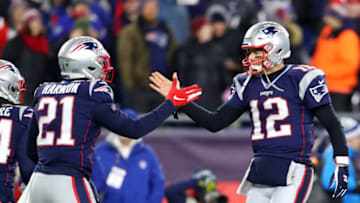 FOXBOROUGH, MASSACHUSETTS - DECEMBER 21: Tom Brady #12 of the New England Patriots celebrates with Duron Harmon #21 in the fourth quarter against the Buffalo Bills at Gillette Stadium on December 21, 2019 in Foxborough, Massachusetts. The Patriots defeat the Bills 24-17. (Photo by Maddie Meyer/Getty Images)