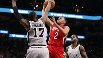 Oct 29, 2016; San Antonio, TX, USA; San Antonio Spurs shooting guard Jonathon Simmons (17) blocks a shot attempt by New Orleans Pelicans point guard Tim Frazier (2) during the second half at AT&T Center. Mandatory Credit: Soobum Im-USA TODAY Sports