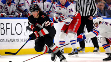 Mar 11, 2023; Buffalo, New York, USA; Buffalo Sabres defenseman Owen Power (25) and New York Rangers center Vincent Trocheck (16) go after a loose puck during the third period at KeyBank Center. Mandatory Credit: Timothy T. Ludwig-USA TODAY Sports