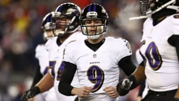 Jan 10, 2015; Foxborough, MA, USA; Baltimore Ravens kicker Justin Tucker (9) celebrates with teammates after kicking field goal against the New England Patriots in the third quarter during the 2014 AFC Divisional playoff football game at Gillette Stadium. Mandatory Credit: Mark L. Baer-USA TODAY Sports