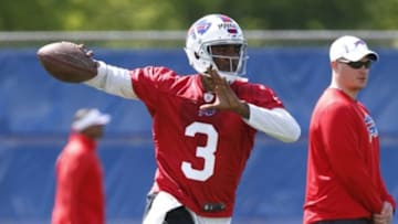 May 28, 2014; Buffalo, NY, USA; Buffalo Bills quarterback EJ Manuel (3) rolls out to pass as Bills offensive coordinator Nathaniel Hackett looks on during organized team activities at Ralph Wilson Stadium. Mandatory Credit: Kevin Hoffman-USA TODAY Sports