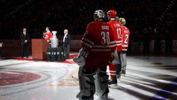Feb 13, 2016; Raleigh, NC, USA; Carolina Hurricanes goalie Cam Ward (30) and forward Eric Staal (12) watch the 10th anniversary celebration before the game against the New York Islanders at PNC Arena. The Carolina Hurricanes defeated the New York Islanders 6-3. Mandatory Credit: James Guillory-USA TODAY Sports