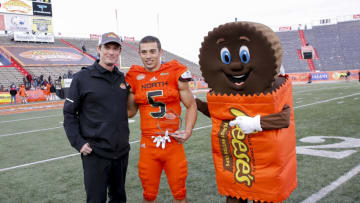 MOBILE, AL - JANUARY 26: Executive Director of the Reese's Senior Bowl Jim Nagy presents Wide Receiver Andy Isabella #5 from Massachusetts of the North Team with a plate naming him the "Most Outstanding Player for the North Team" after the 2019 Reese's Senior Bowl at Ladd-Peebles Stadium on January 26, 2019 in Mobile, Alabama. The North defeated the South 34 to 24. (Photo by Don Juan Moore/Getty Images)