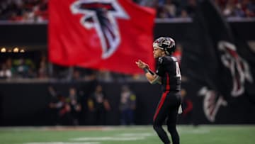 Jan 1, 2023; Atlanta, Georgia, USA; Atlanta Falcons quarterback Desmond Ridder (4) reacts after a touchdown against the Arizona Cardinals in the first half at Mercedes-Benz Stadium. Mandatory Credit: Brett Davis-USA TODAY Sports