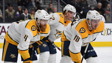 LAS VEGAS, NEVADA - FEBRUARY 16: Ryan Ellis #4, Kevin Fiala #22 and Colton Sissons #10 of the Nashville Predators wait for a faceoff in the second period of a game against the Vegas Golden Knights at T-Mobile Arena on February 16, 2019 in Las Vegas, Nevada. The Golden Knights defeated the Predators 5-1. (Photo by Ethan Miller/Getty Images)