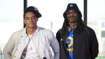 Feb 4, 2015; Las Vegas, NV, USA; Recording artist Snoop Dogg stands beside his son Cordell Broadus during a press conference announcing his commitment to UCLA at Bishop Gorman High School. Mandatory Credit: Stephen R. Sylvanie-USA TODAY Sports