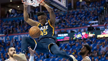 OKLAHOMA CITY, OK - APRIL 15: Donovan Mitchell #45 of the Utah Jazz dunks two points against the Oklahoma City Thunder during the first half of a NBA playoff game at the Chesapeake Energy Arena on April 15, 2018 in Oklahoma City, Oklahoma. (Photo by J Pat Carter/Getty Images) *** Local Caption *** Donovan Mitchel;