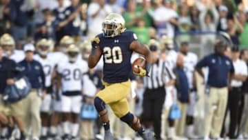 Sep 19, 2015; South Bend, IN, USA; Notre Dame Fighting Irish running back C.J. Prosise (20) carries the ball for a 91 yard touchdown against the Georgia Tech Yellow Jackets in the fourth quarter at Notre Dame Stadium. Mandatory Credit: RVR Photos-USA TODAY Sports